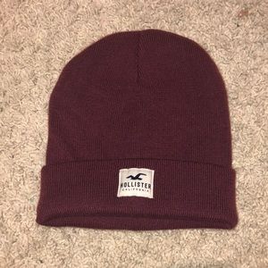 Maroon/red colored beanie hat by Hollister